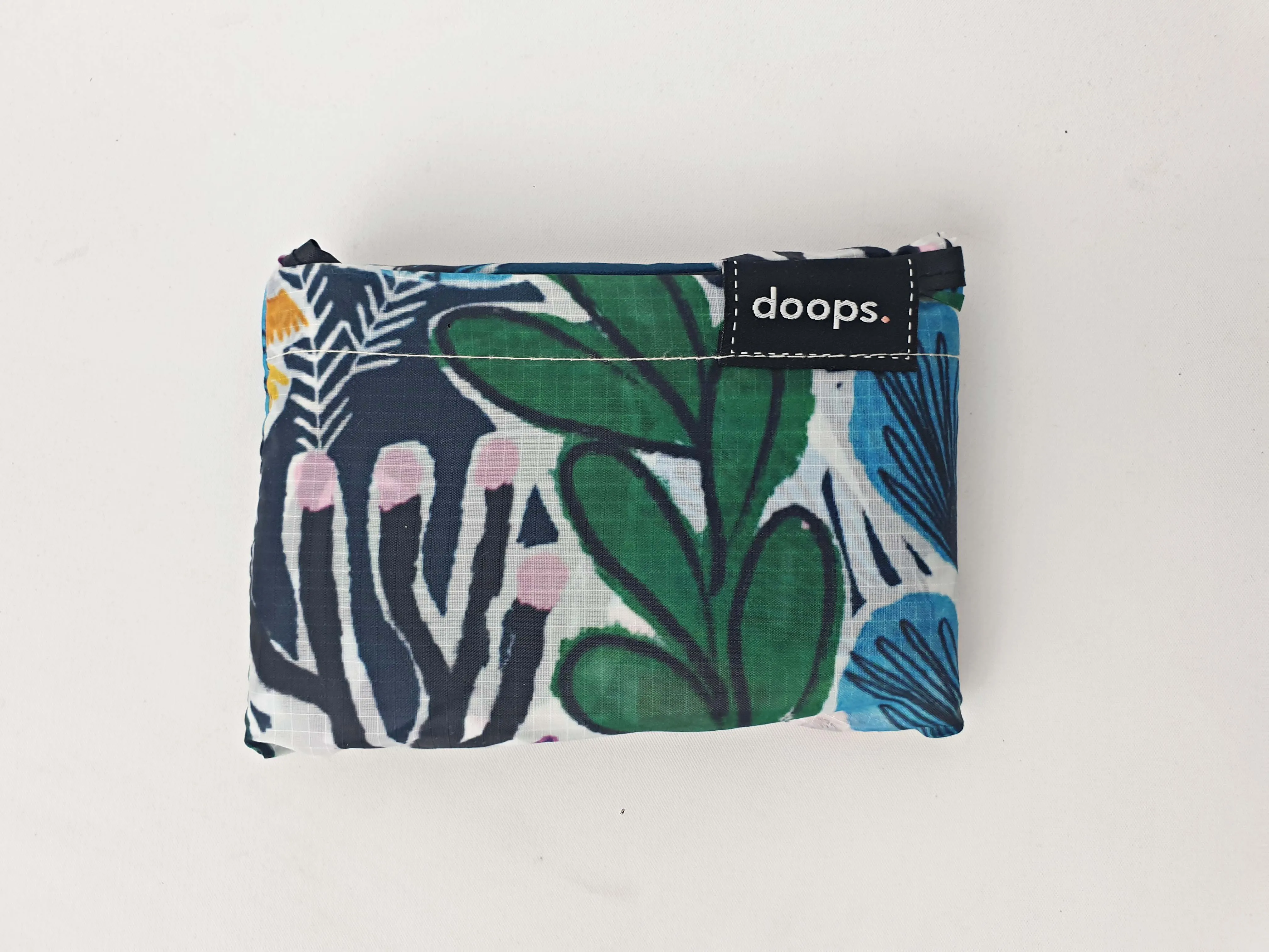 Doops deep green-based unique print compact shopping bag