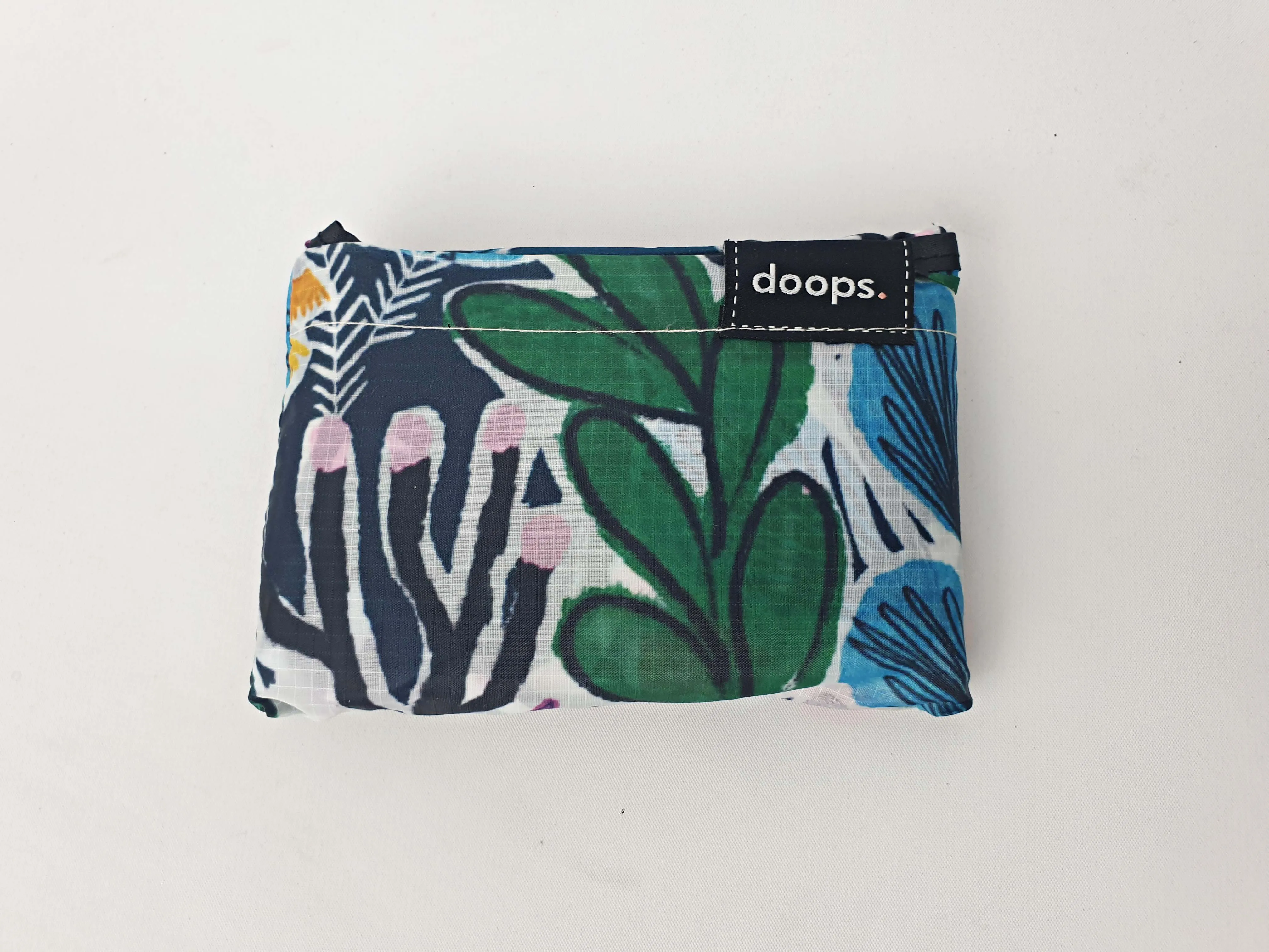 Doops deep green-based unique print compact shopping bag