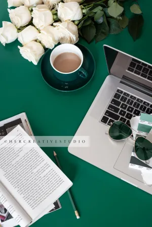 Laptop, Roses & Coffee on Green Background. Digital Stock Image
