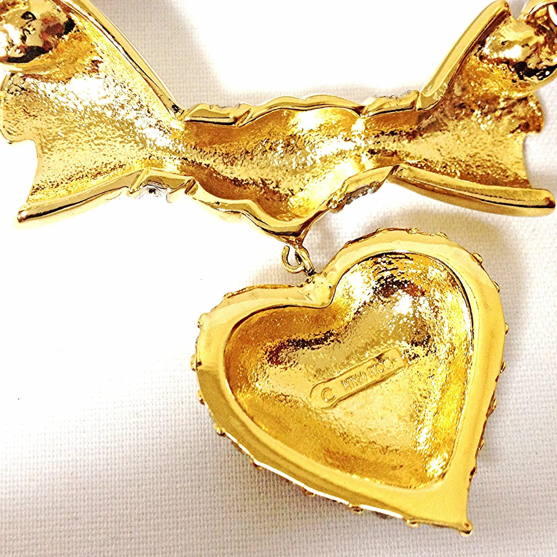 MINT. Vintage Nina Ricci golden chain statement necklace with ribbon bow and crystal stone heart pendant top. Perfect vintage jewelry