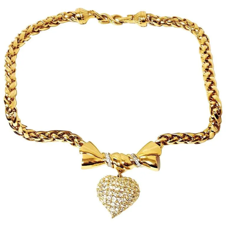 MINT. Vintage Nina Ricci golden chain statement necklace with ribbon bow and crystal stone heart pendant top. Perfect vintage jewelry
