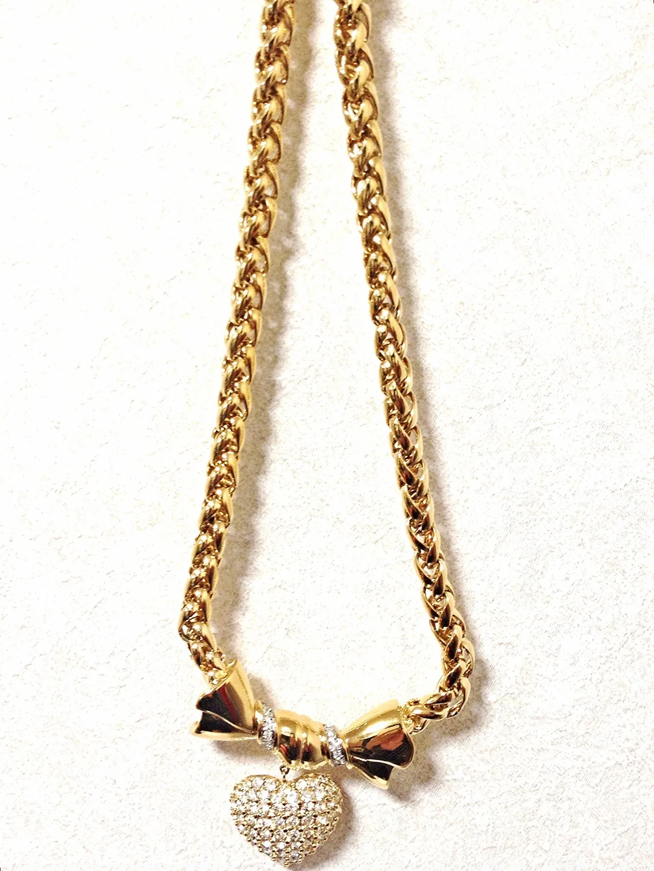 MINT. Vintage Nina Ricci golden chain statement necklace with ribbon bow and crystal stone heart pendant top. Perfect vintage jewelry
