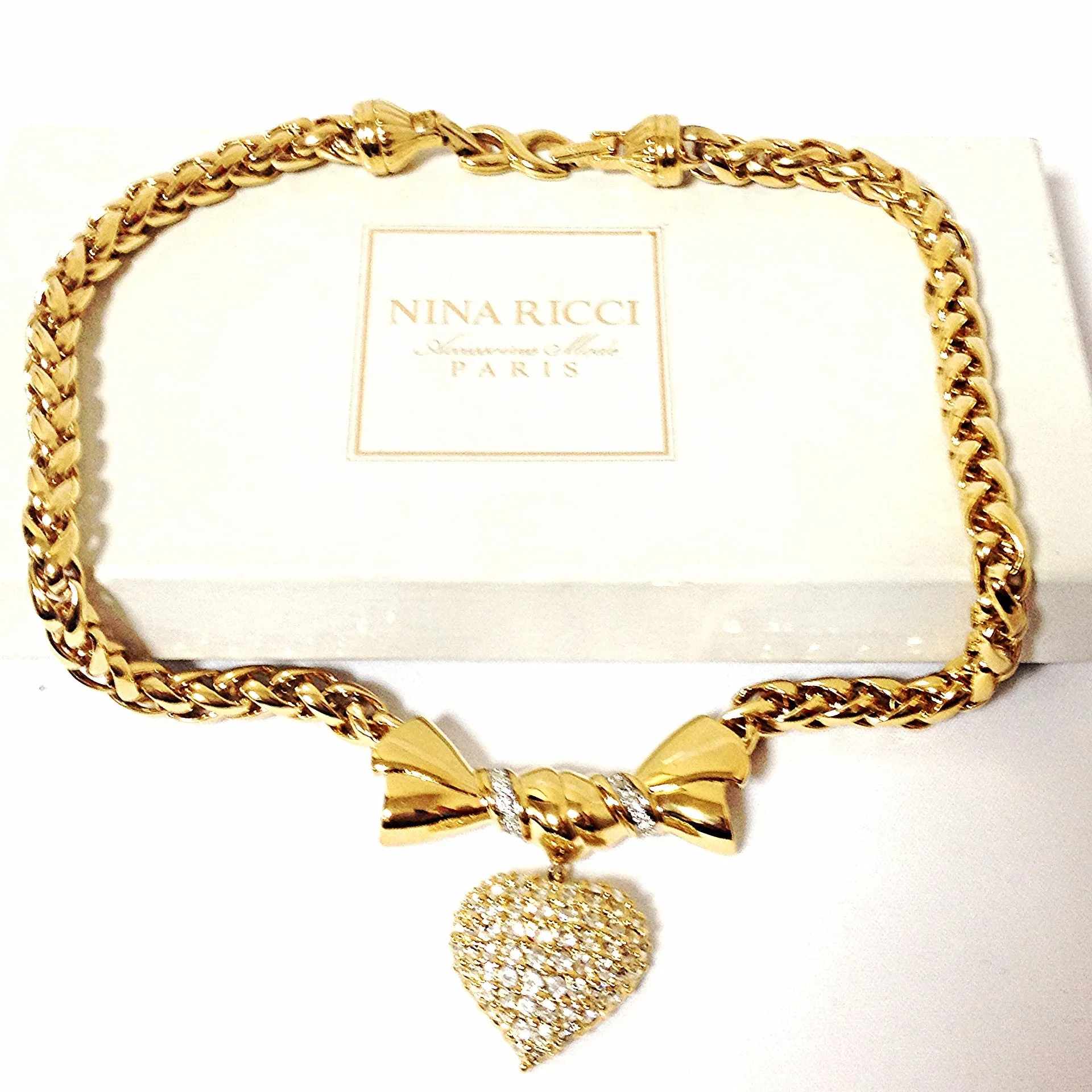 MINT. Vintage Nina Ricci golden chain statement necklace with ribbon bow and crystal stone heart pendant top. Perfect vintage jewelry
