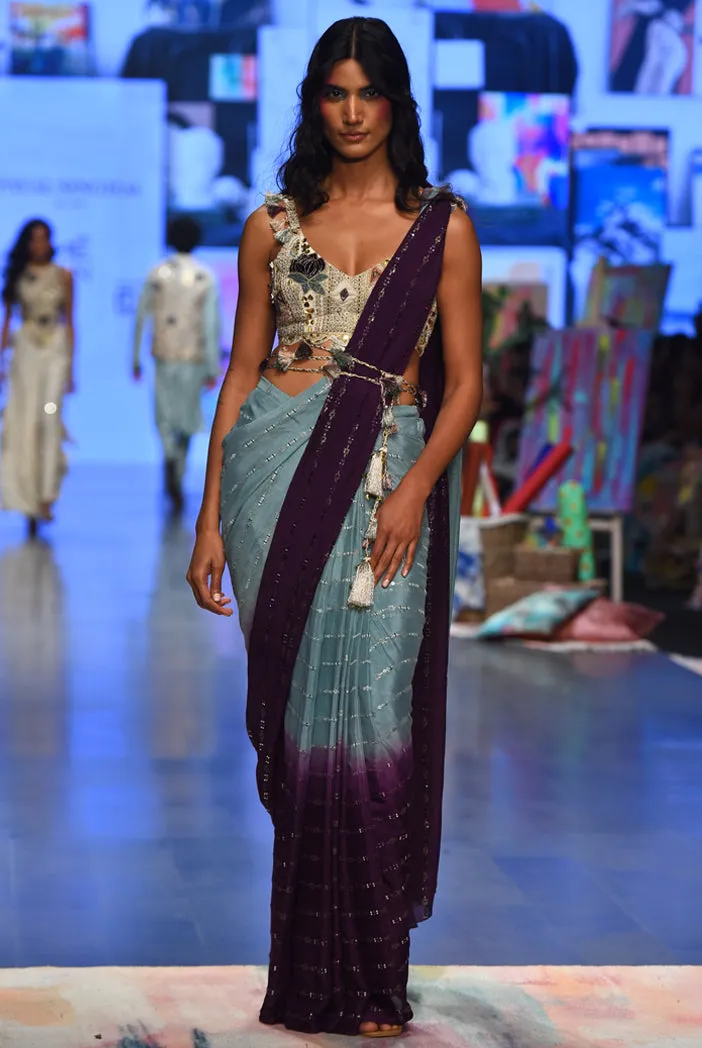 NIYA OFF WHITE GEORGETTE EMBROIDERED CHOLI WITH POWDER BLUE AND PURPLE GEORGETTE SEQUINS SAREE